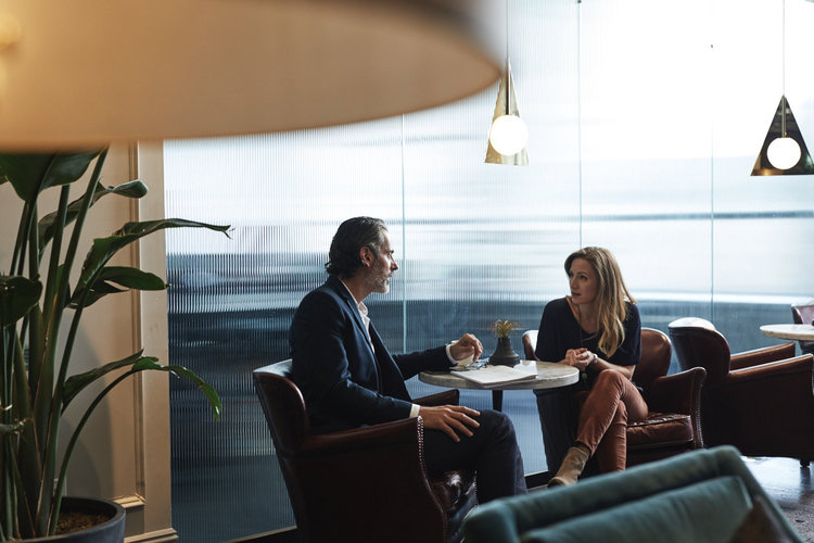 man and woman discussing working for yourself