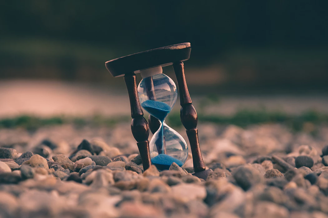 hourglass situated on stones