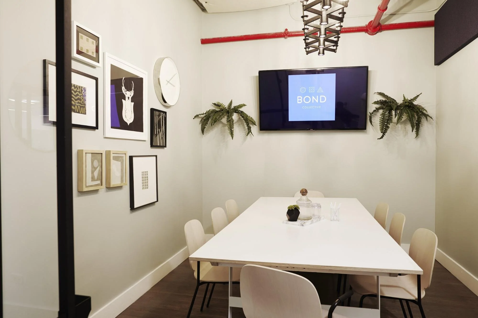 Conference room  with white table and chairs in a flexible office space