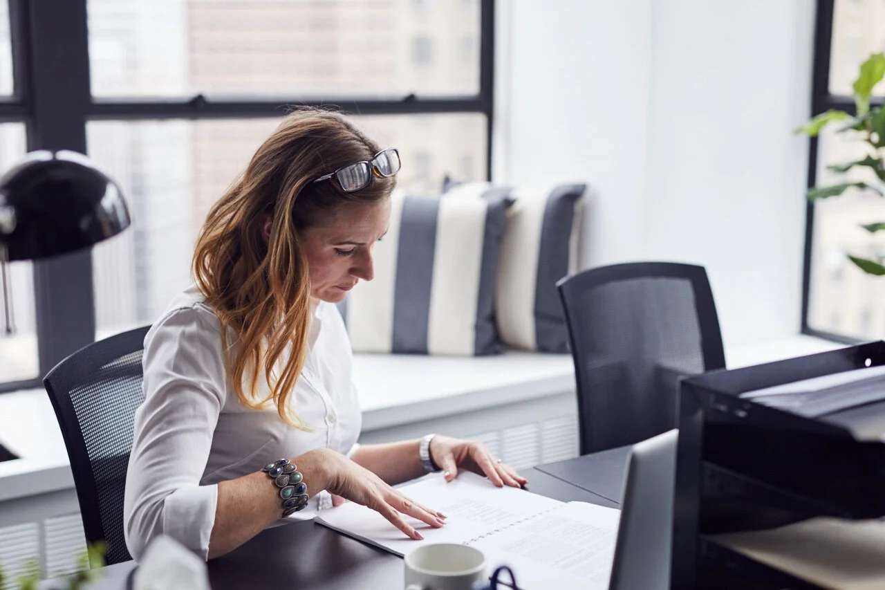 Woman looking at how much it costs to start a business