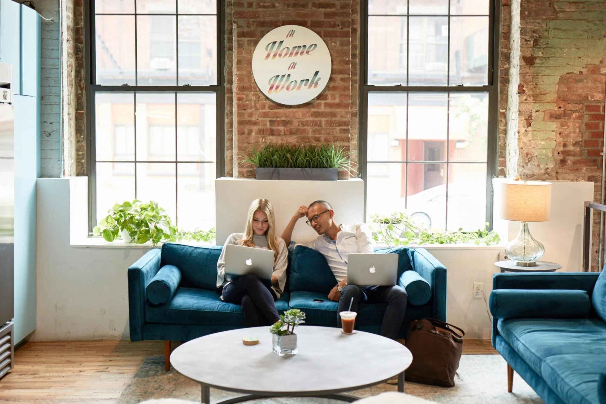 Two people happy at their home office