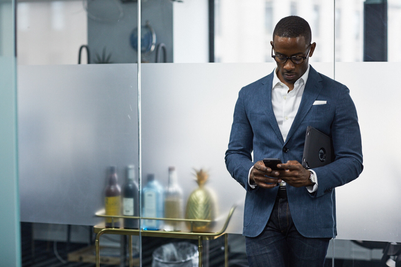 Man standing while working in office space