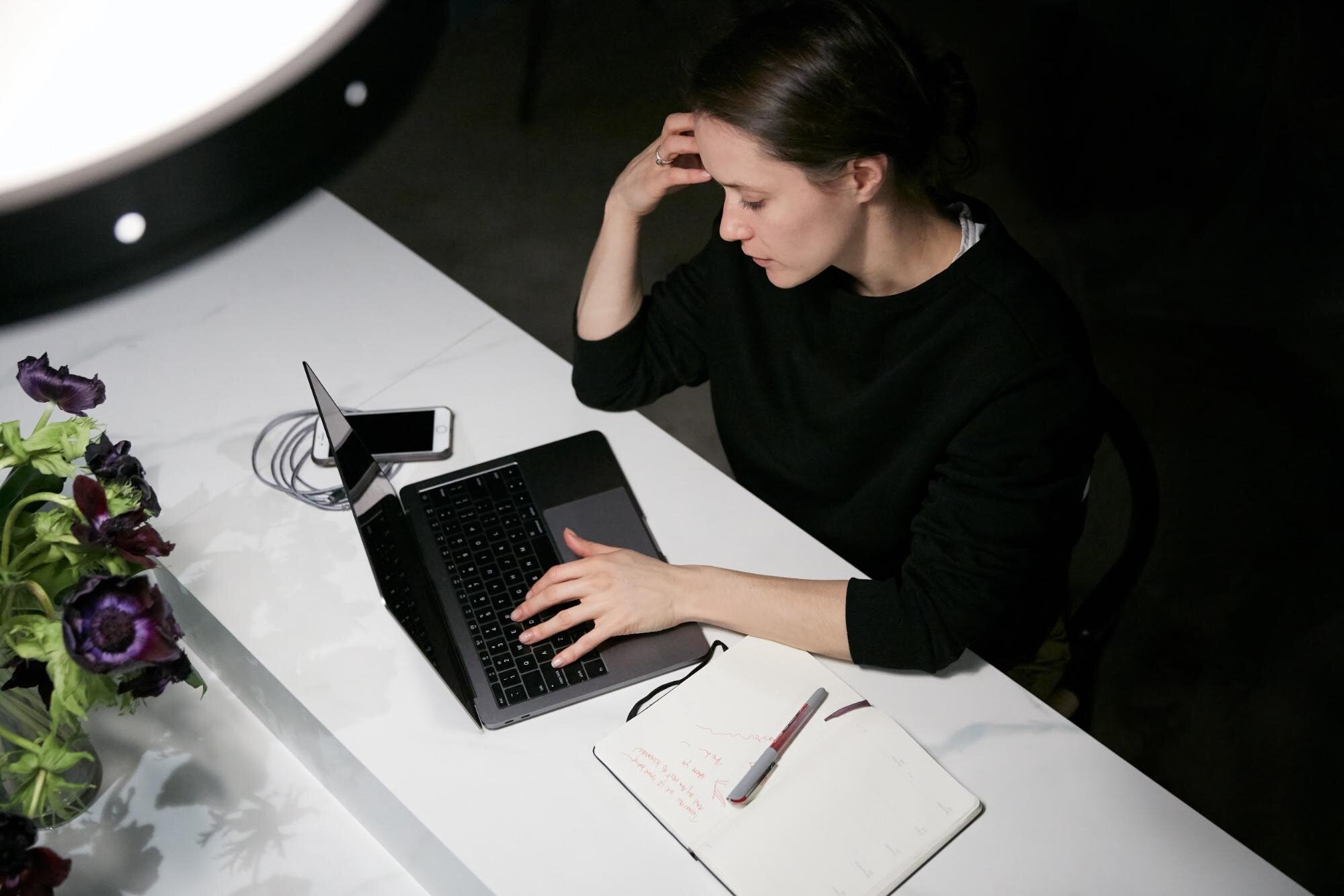 Woman at desk experiencing employee burnout