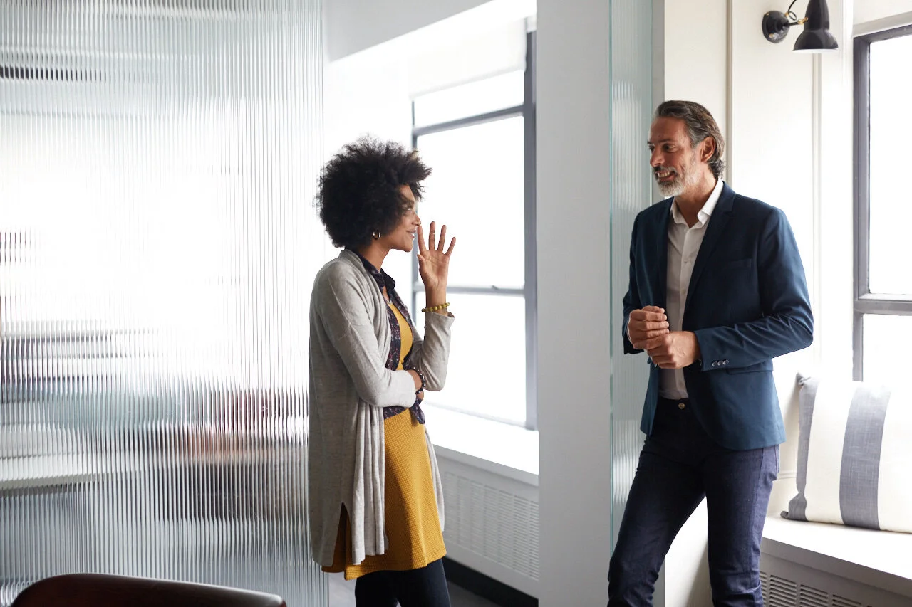 Coworkers talking with each other about workplace inclusion