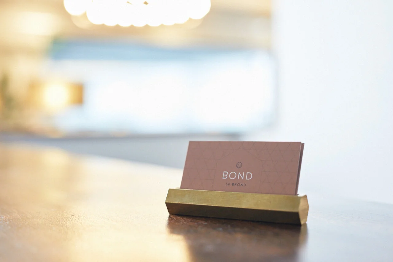 Bond Collective business card in holder