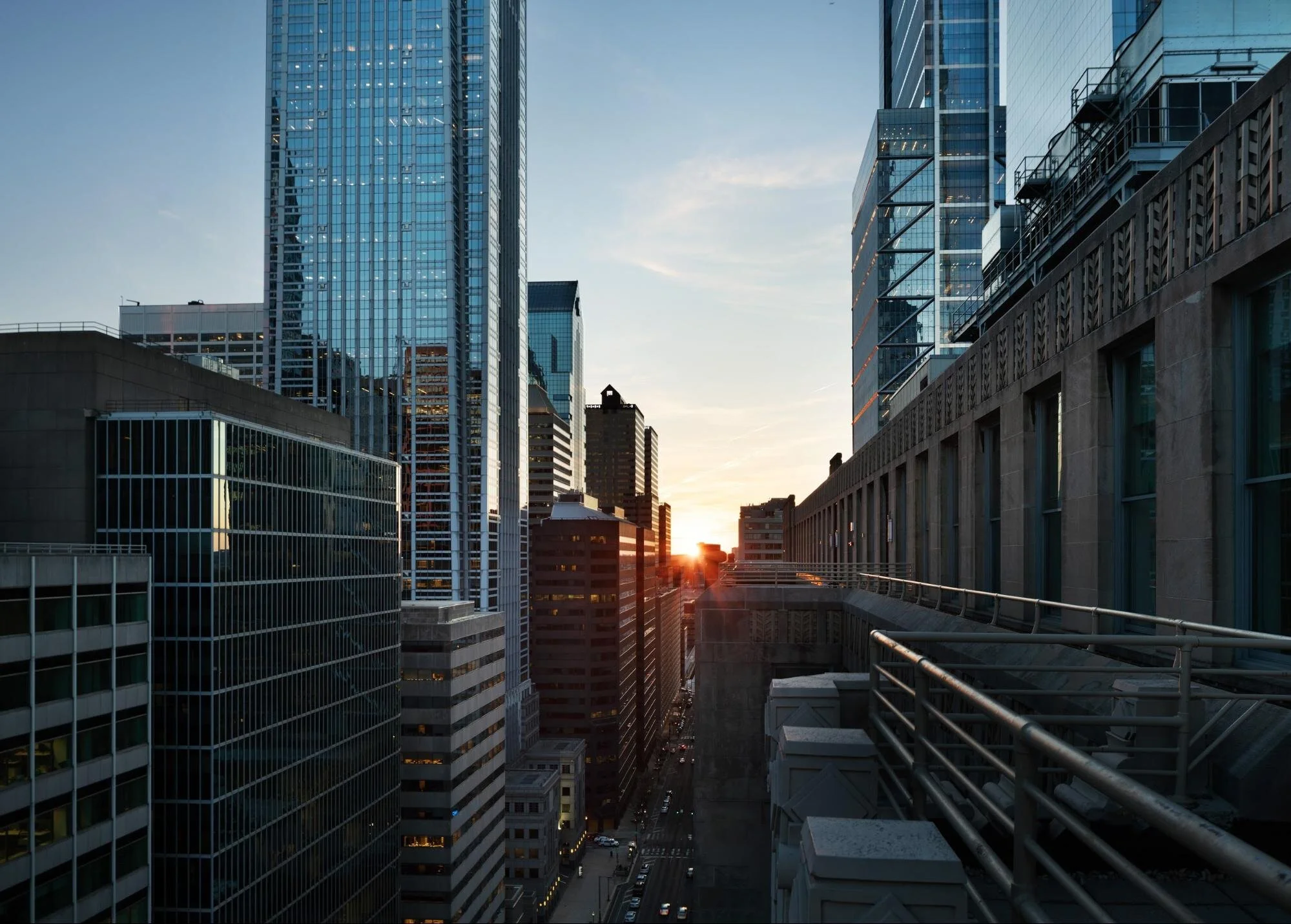 Sun shinning through downtown city buildings