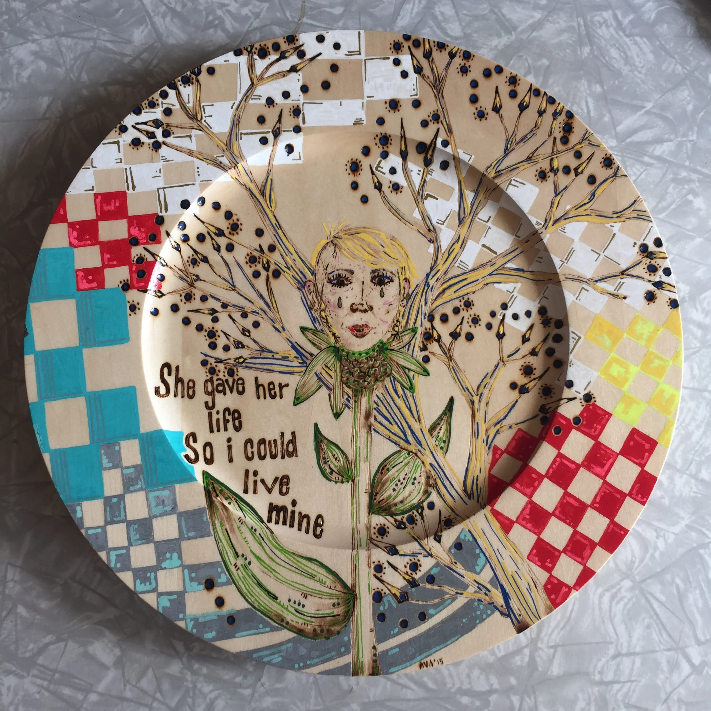  mothers   pyrography and acrylic on birch plate     2015    12’’ 