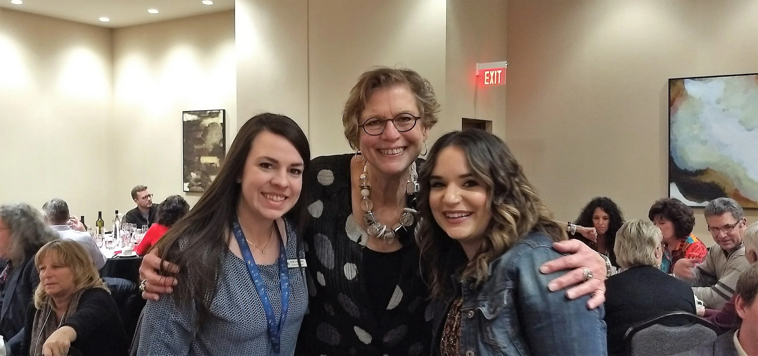 Cathy (center) is happy to be around other wine aficionados