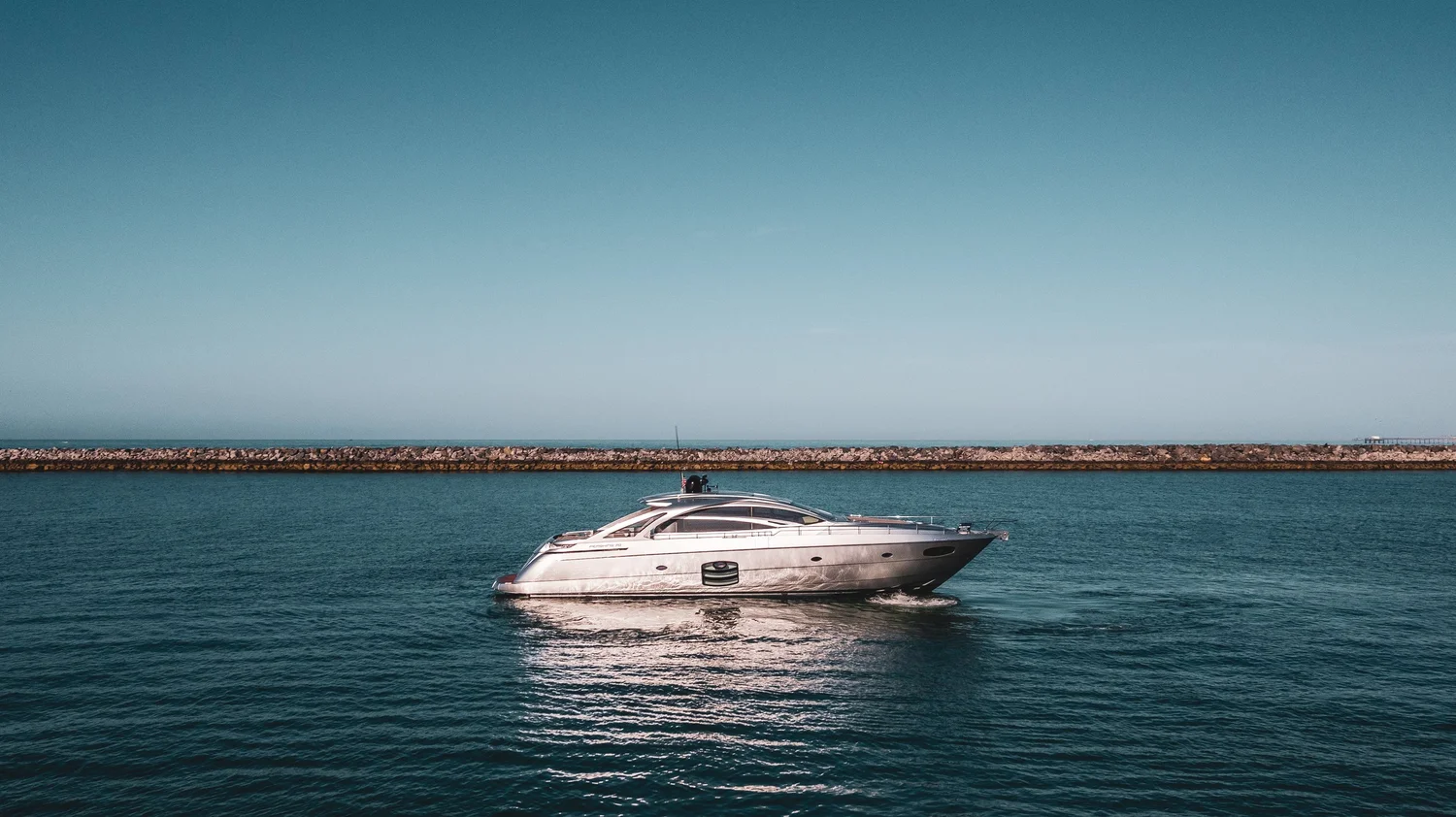 Luxury yacht cruising along the coast
