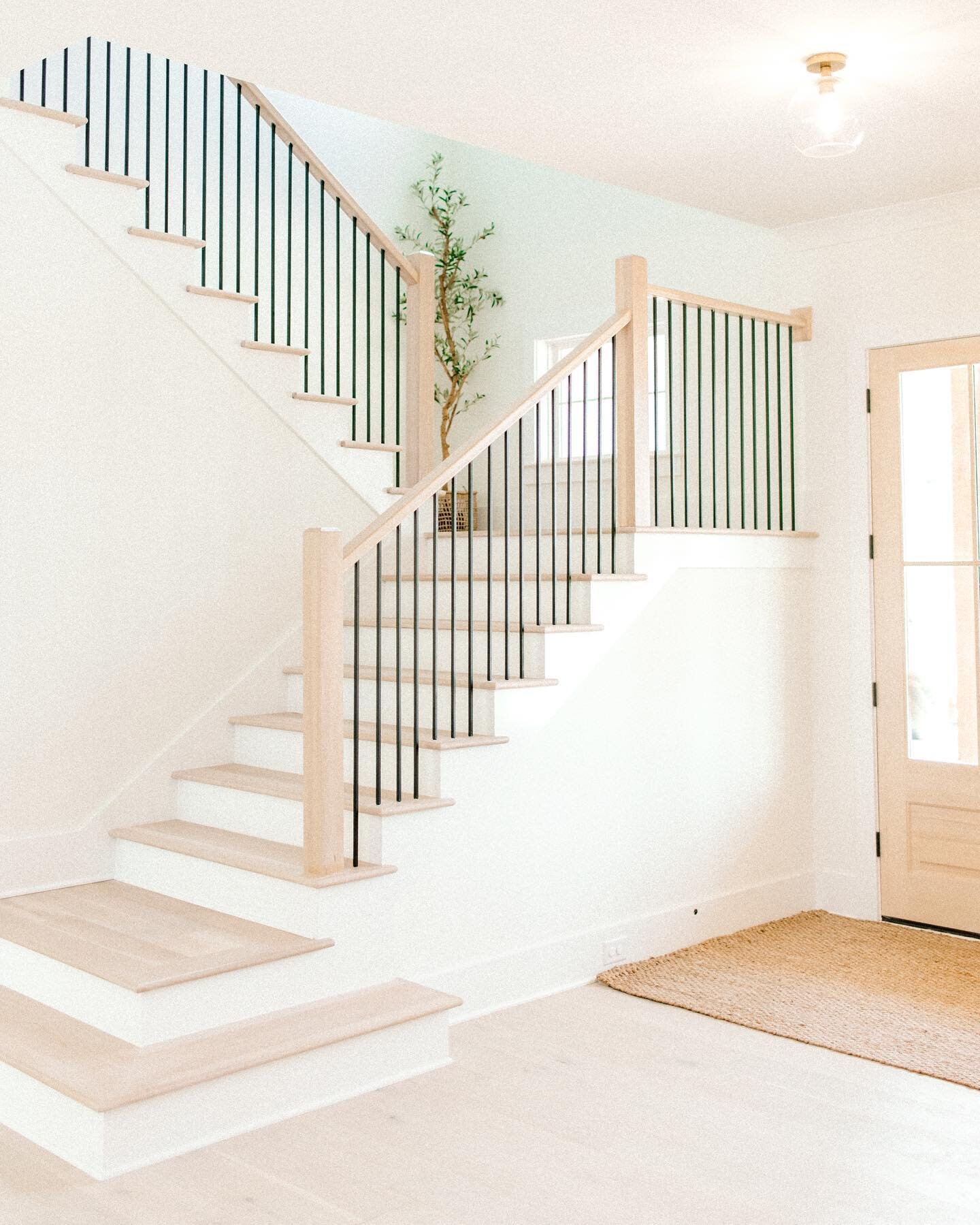 one of my favorite views. 😍 the layered platforms at the bottom of the stairs were a must have for me and I just love how they turned out. 
&bull;
hardwoods are @mohawkflooring coastal couture in the color &ldquo;seaspray&rdquo; and after looking at