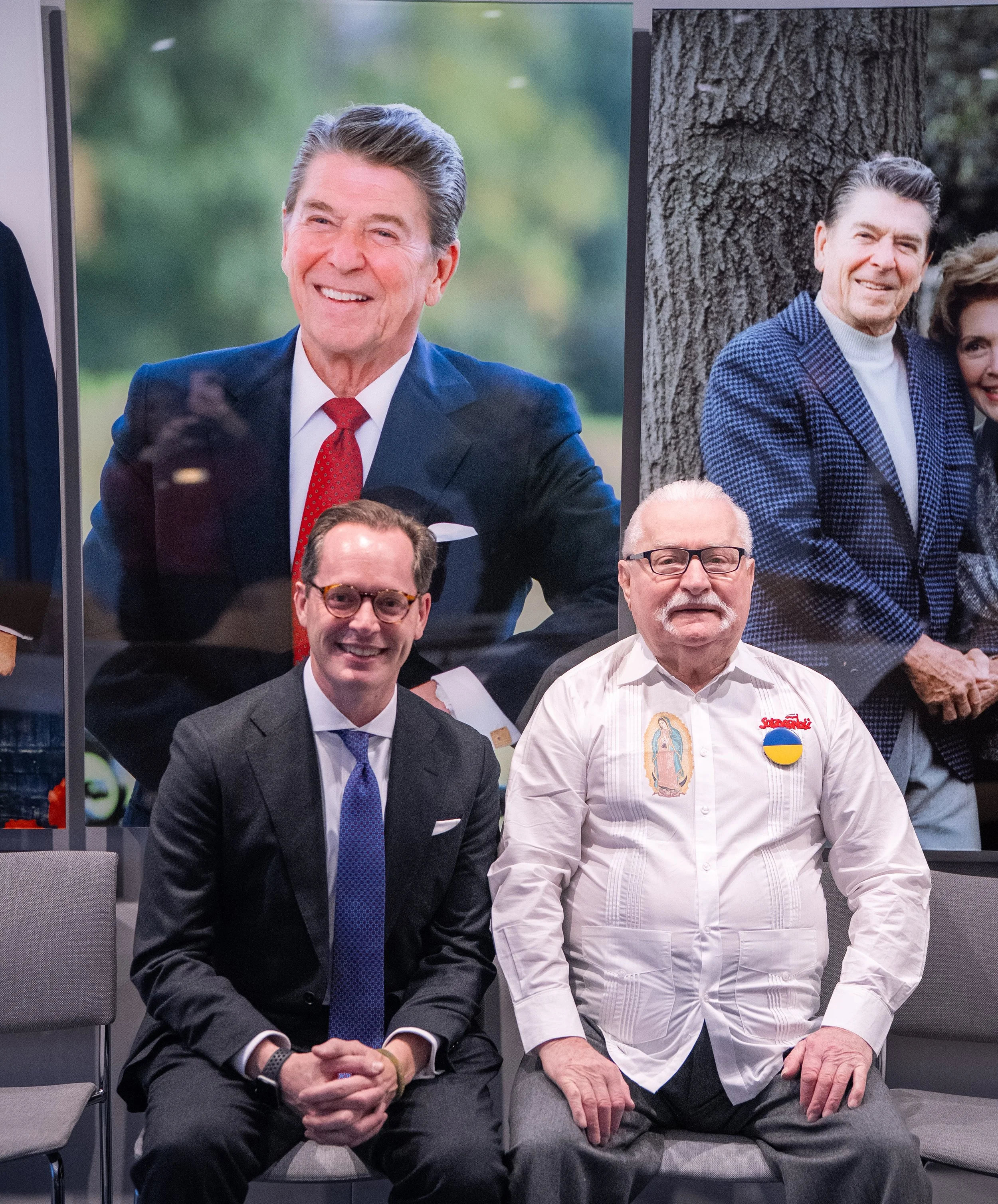 Executive Director Roger Zakheim sits with former Polish President Lech Wałęsa.