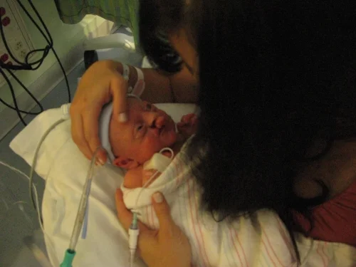 Lauren with Jonathan in his NICU home.