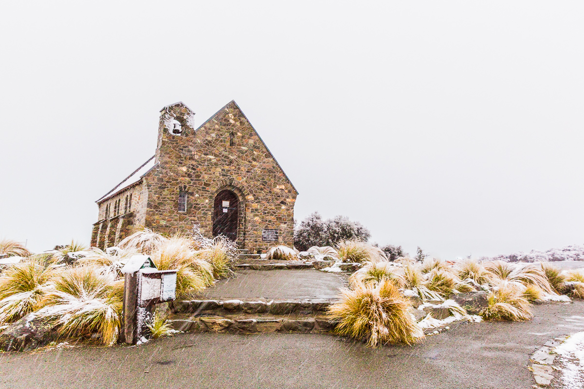 snow-snowing-lake-tekapo-church-good-shepherd-south-island-storm-autumn-landscape.jpg