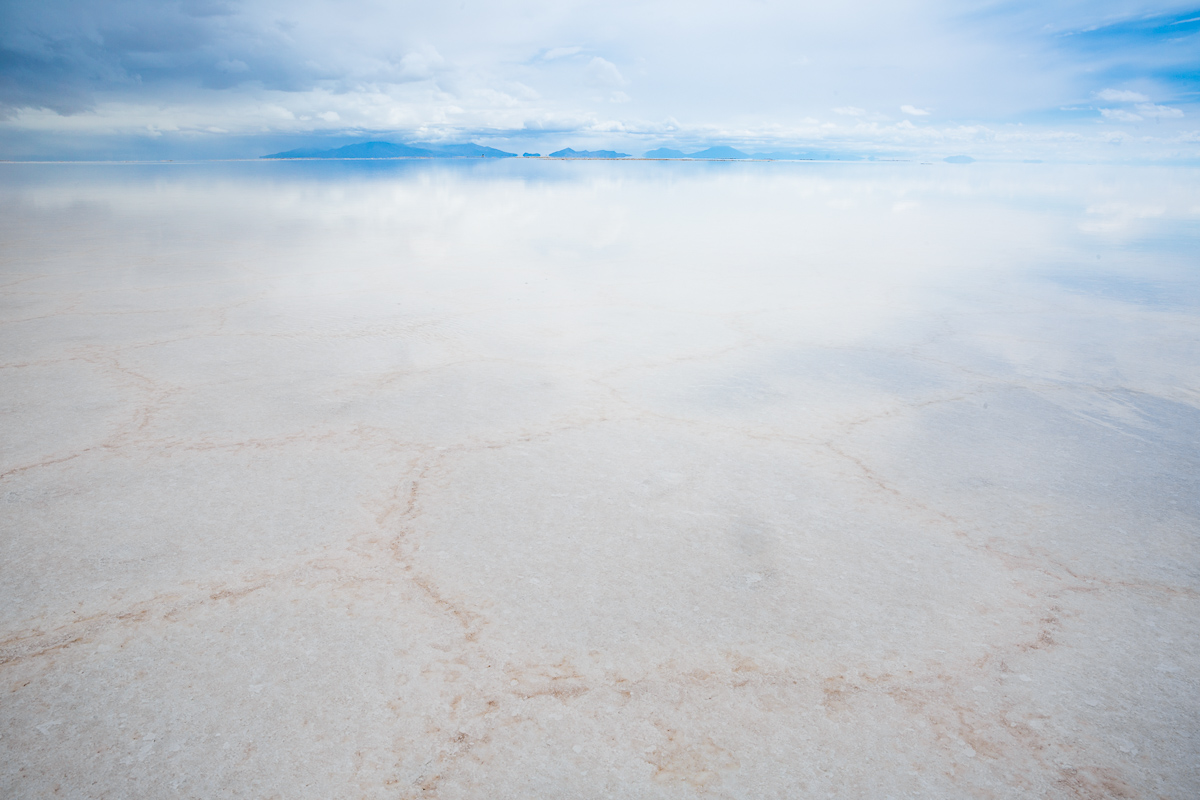 reflection-rain-salar-de-uyuni-potosi-bolivia-salt-flat-bolivian-mountain-reflected-sky-photograph.jpg