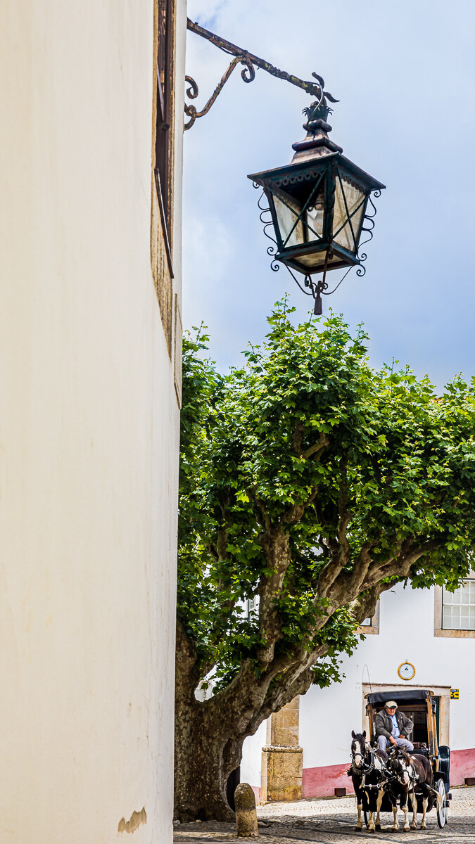 horse-carriage-medieval-town-obidos-portugal-village-centre-church-travel-photographer-photography.jpg