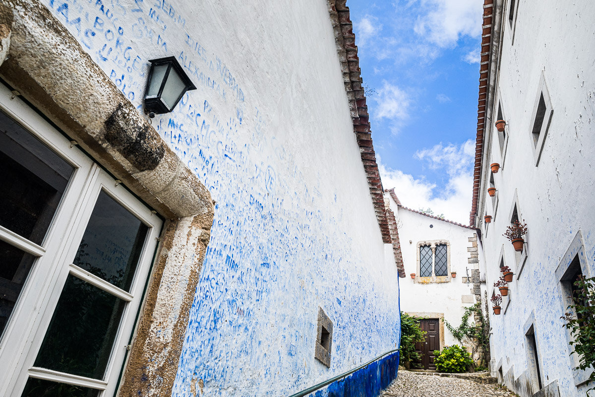 medieval-town-obidos-village-city-portugal-street-walls-white-blue-architecture-houses-photography-travel.jpg