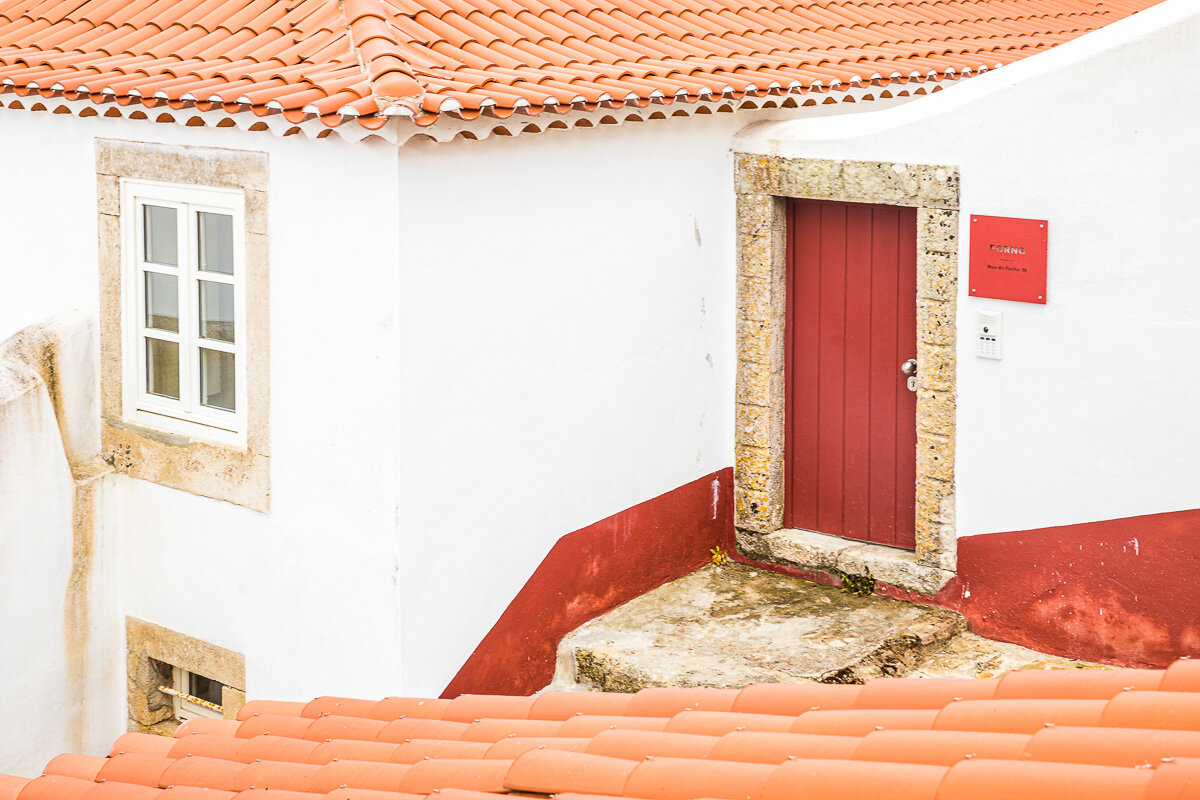 obidos-portugal-architecture-door-window-red-white-theme-medieval-village-town-highlights-tour.jpg