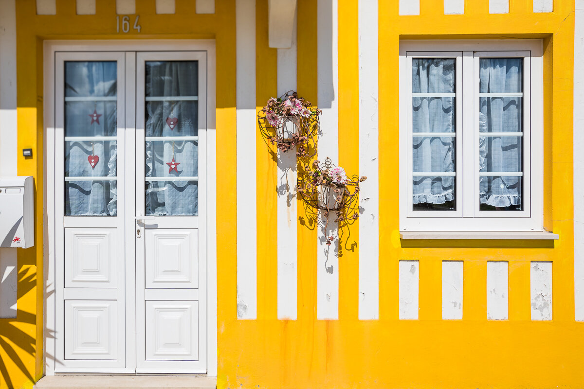 costa-nova-portugal-beach-house-yellow-portugal-door-window-travel-photography.jpg
