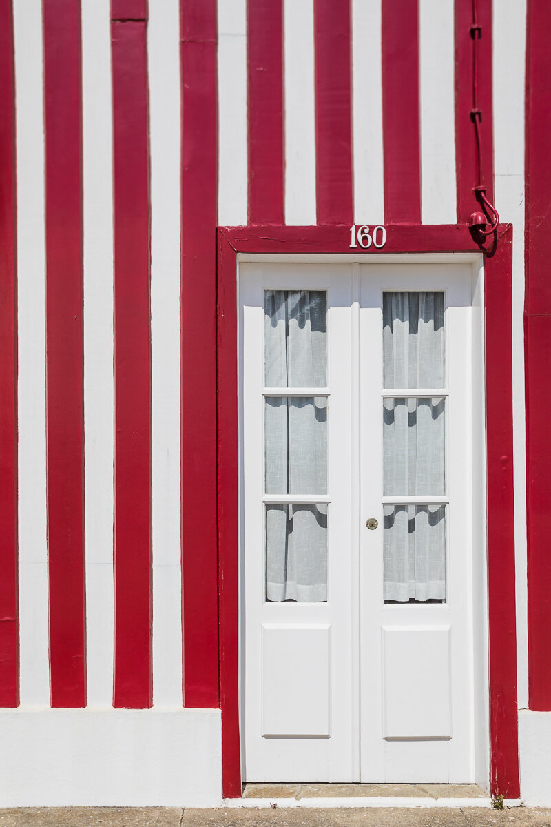 door-beach-house-costa-nova-town-portugal-waterfront-striped-red-white.jpg