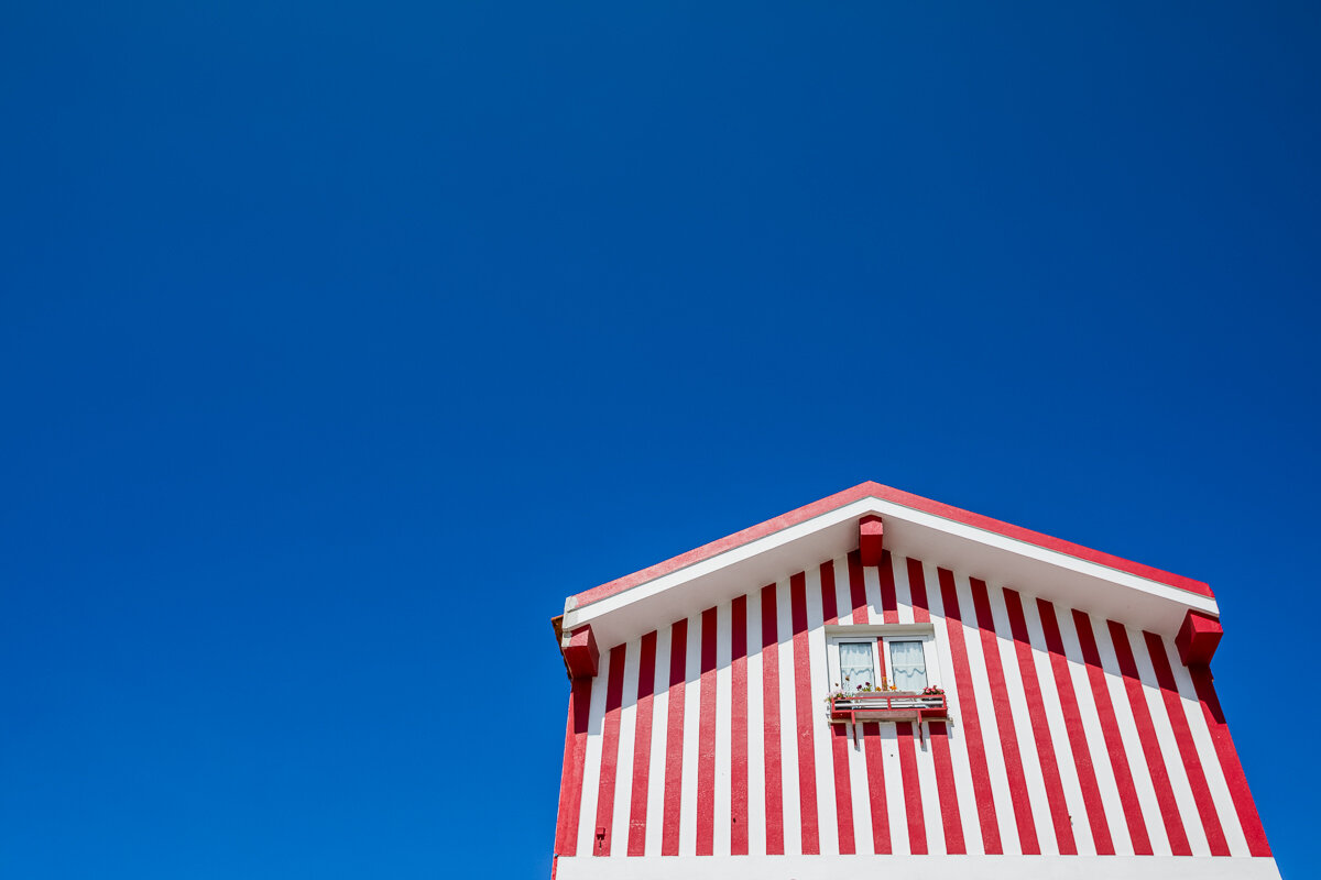 portugal-striped-beach-house-waterfront-red-white-blue-sky-minimalist-travel-photography-photographer.jpg