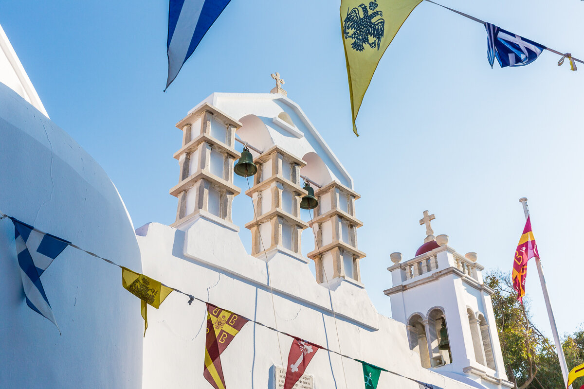 mykonos-island-travel-greece-greece-archipelago-cyclades-flags-bells-church.jpg