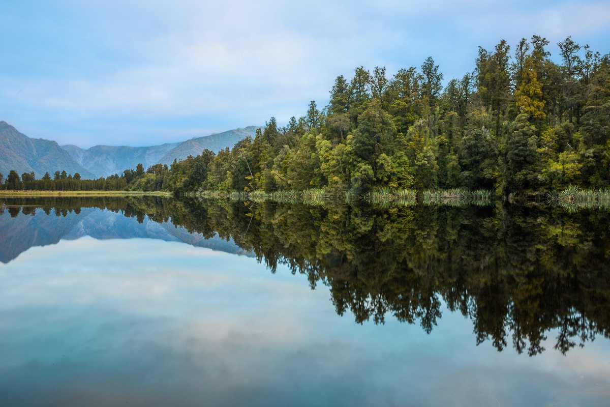 lake-matheson-reflections-franz-josef-village-west-coast-travel-fiordland-new-zealand-south-island.jpg