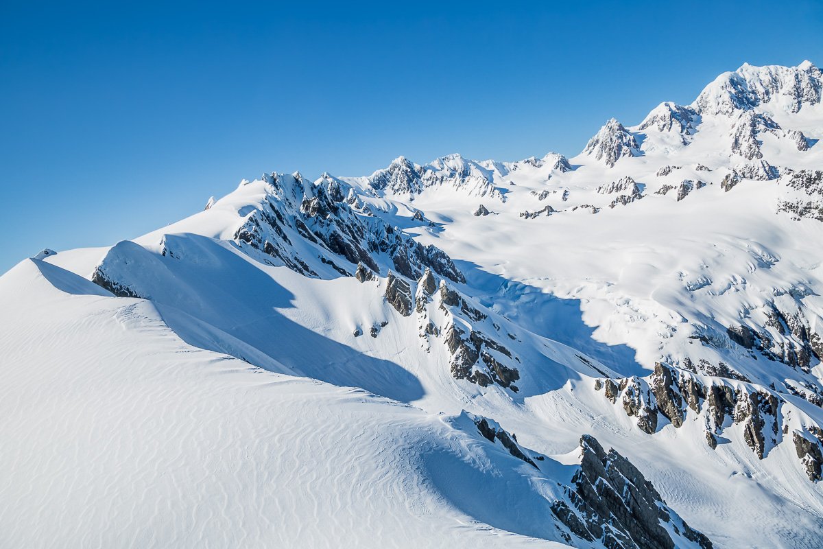 glacier-fox-flight-travel-new-zealand-franz-josef-snow-landing-helicopter-travel.jpg