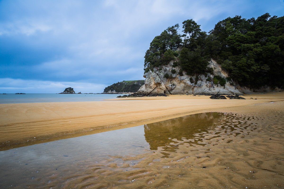 kaiteriteri-beach-nelson-abel-tasman-national-orange-sand-coastline-ocean.jpg