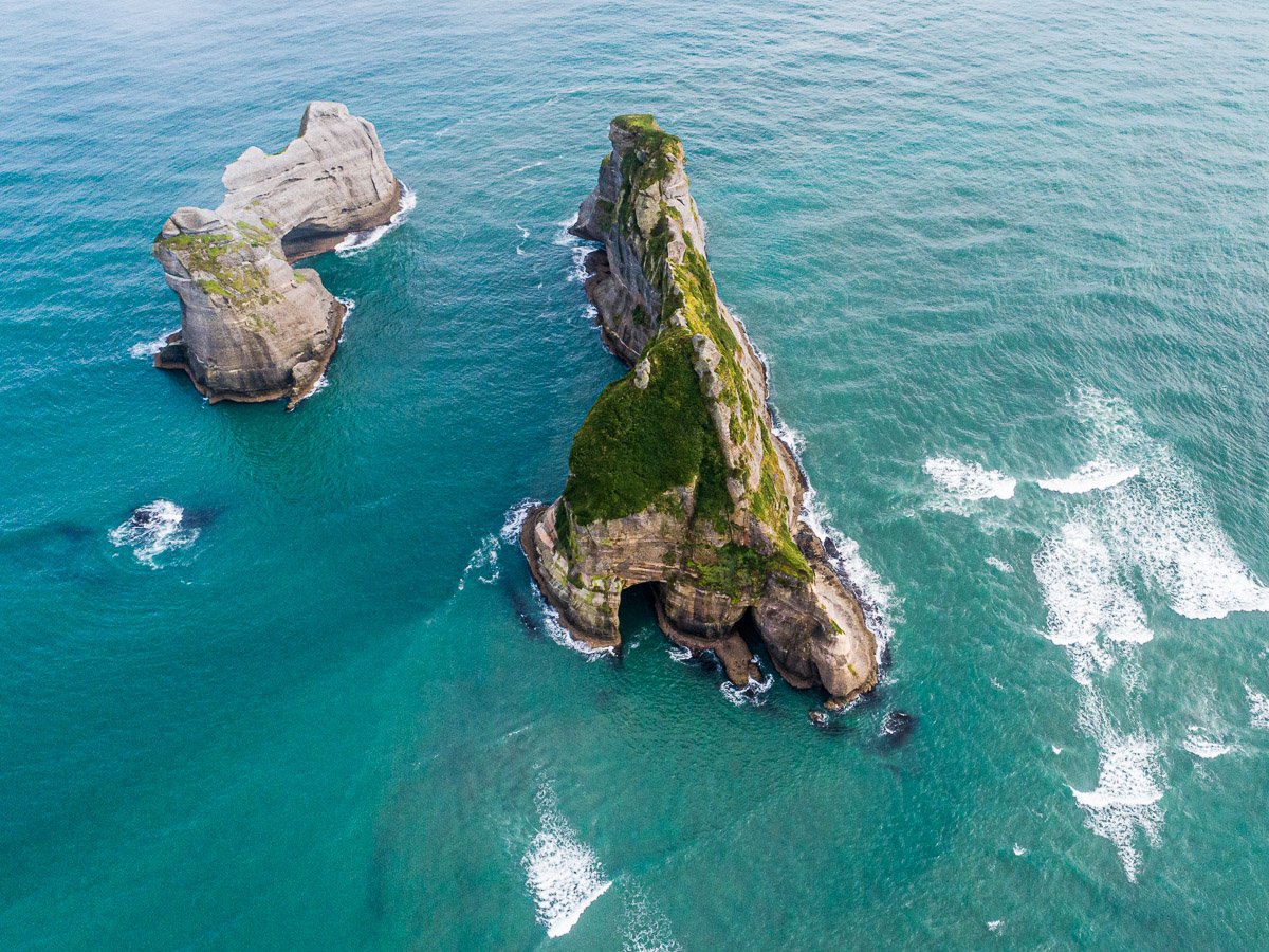 wharariki-beach-new-zealand-windows-screensaver-sea-dji-drone-aerial-flight-south-island-puponga.jpg