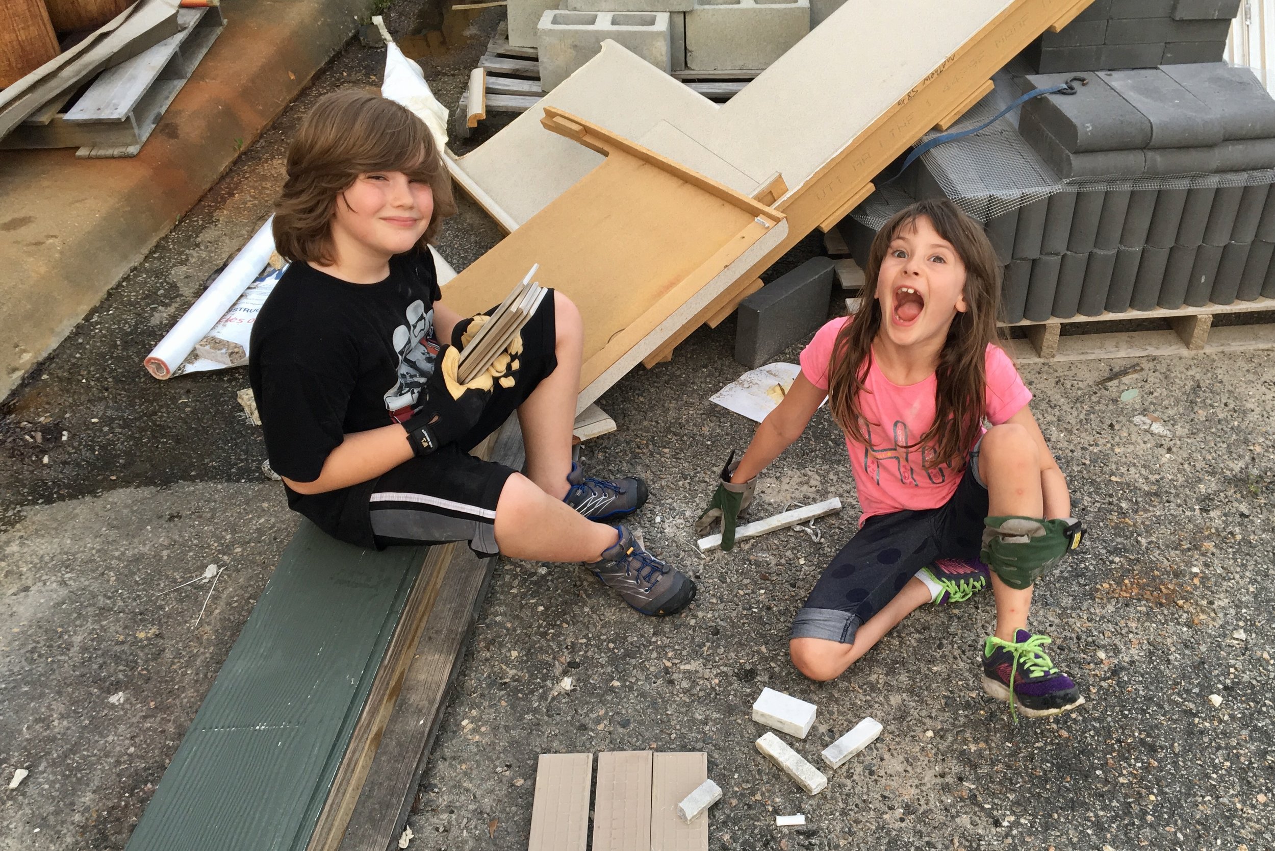 Ian and Maylee digging through the trash at the end of an exciting day.