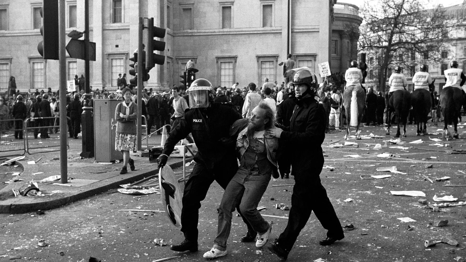 Poll Tax Riots UK. London. 31 March 1990. 100,000 turned out in Trafalgar Square against the introduction of the Poll Tax in March 1990. Designed as a replacement for the Rate Tax that had been used since the 17th Century, the tax was imposed on individuals rather than property. Many found this system saved the rich money, whilst the poor had to pay more. The tax was replaced soon after, with its unpopularity contributing to the downfall of Prime Minister Margaret Thatcher. Photographer: Unknown