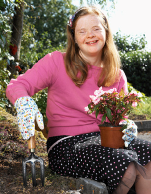 Girl with Downs Gardening