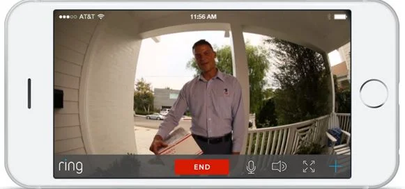  Image: A smartphone shows the Ring app, revealing a postman at the door delivering a package. 