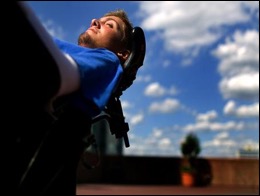  Brian relaxes in his wheelchair under a blue sky. Source: www.briankeefer.org 