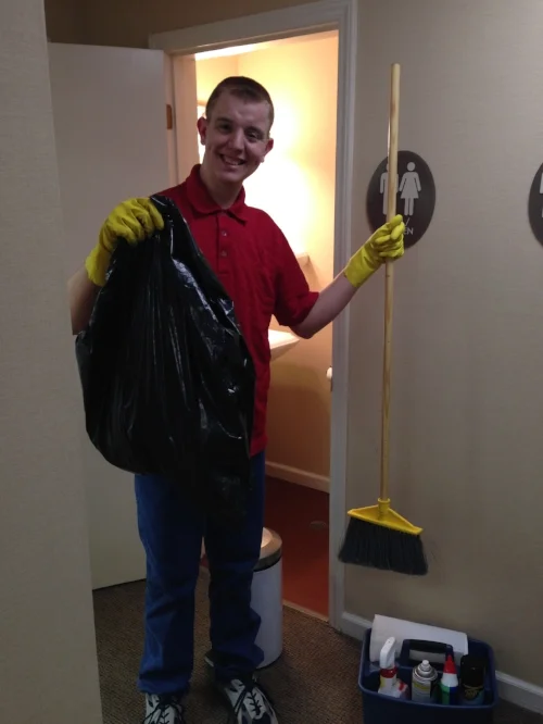  Bryan shows off his cleaning supplies. 