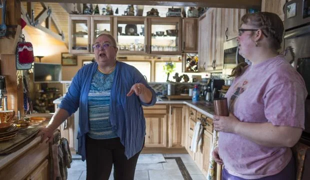 Photo by Michael Penn / The Juneau Empire: Gina and her mom talk in their kitchen.