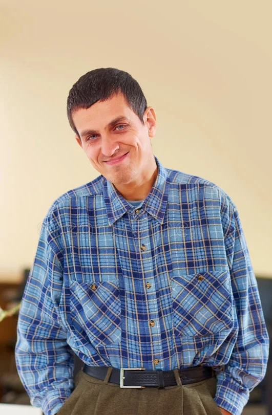 A man looks at the camera smiling.jpg