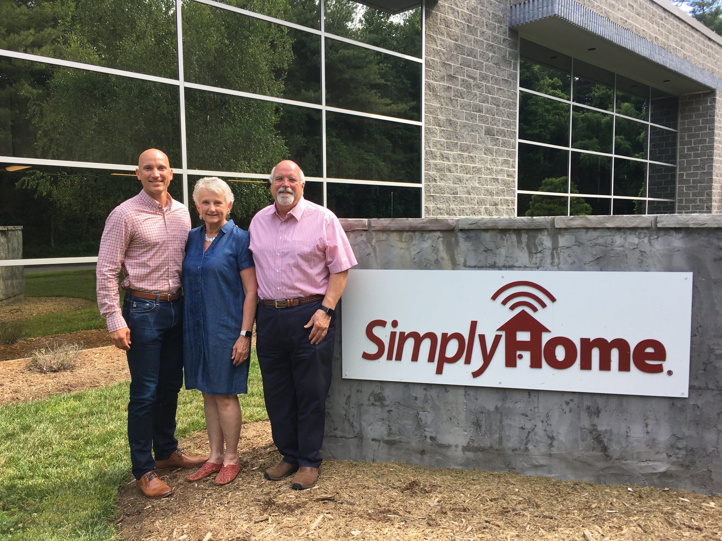   The Rays (Jason, Drue, and Allen) pose for a picture outside the  Simply Home offices.  