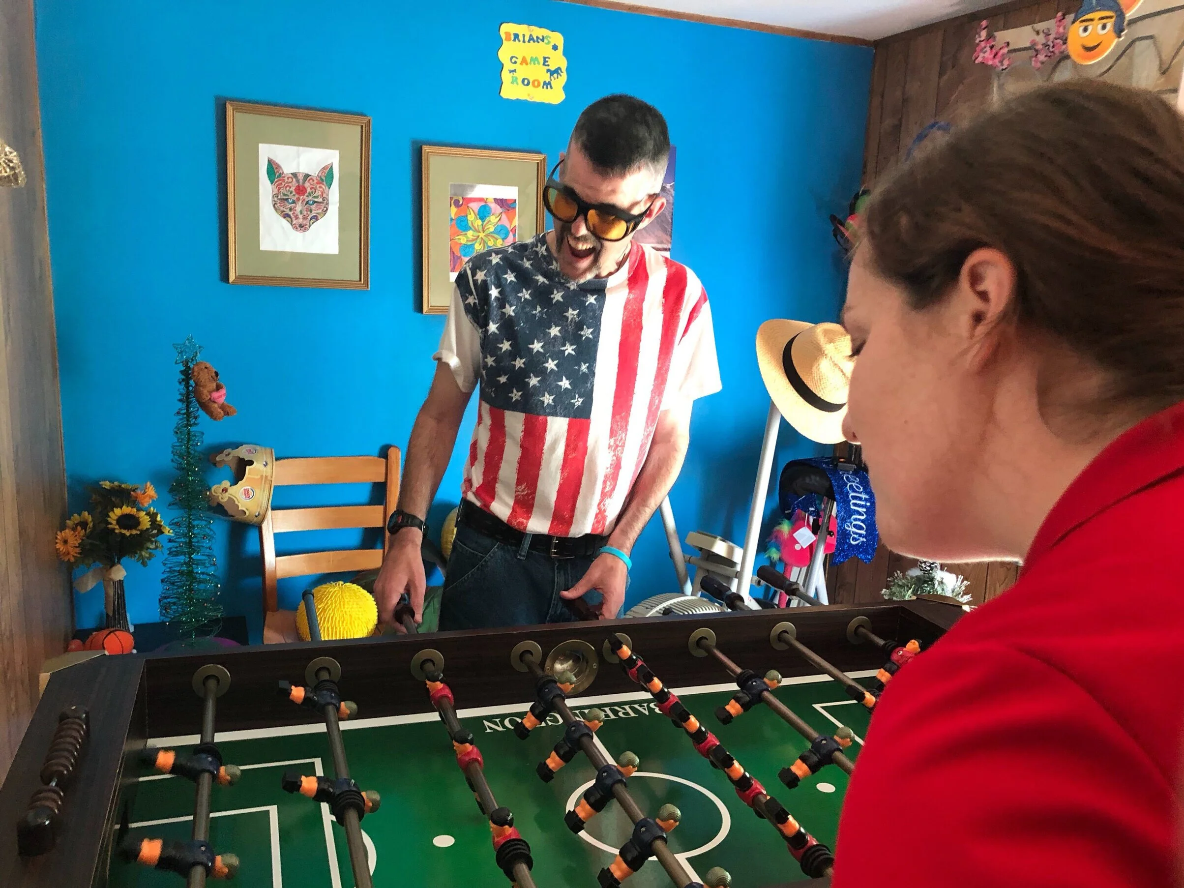   Brian demonstrates his formidable foosball skills.  