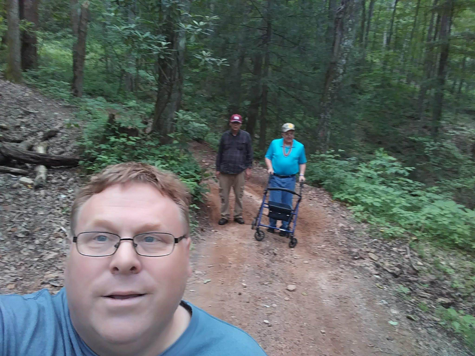  As a DSP, Terry (left) has been able to encourage James (at right) to use technology to communicate and to feel more secure on unfamiliar terrain.  