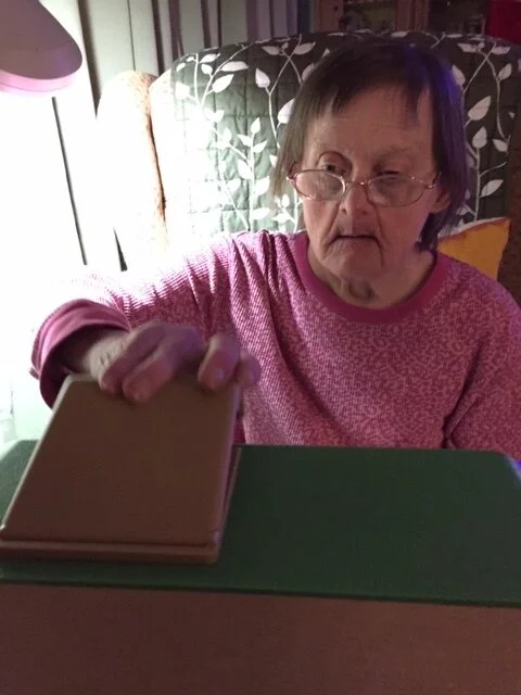  Carla using her Simpl music player. 