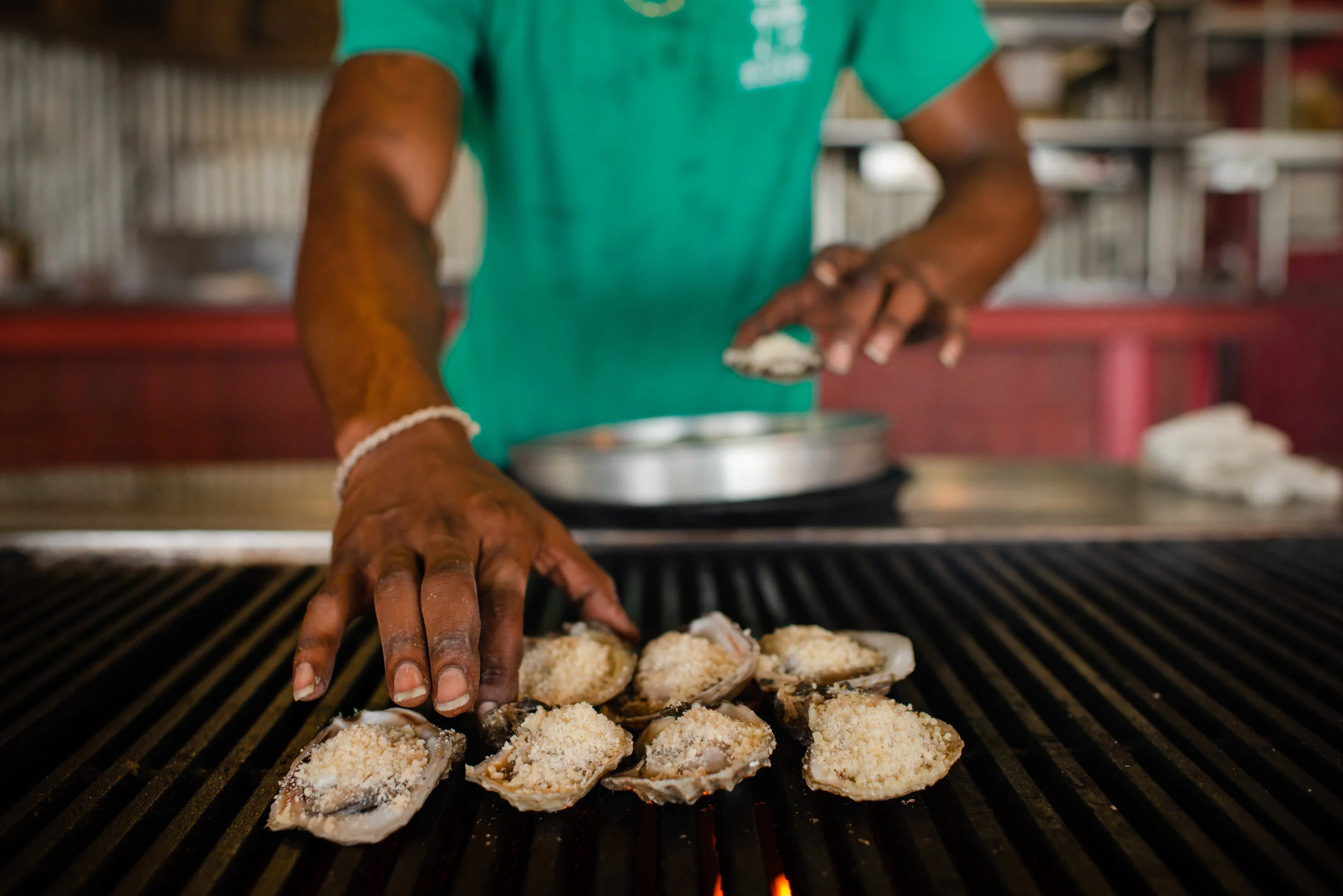 Dwayne Griggs, 22, has been prepares oysters at Boss Oyster for four years, however he is not a traditional oysterman. “Never tried one” and “not a big fan of boats,” Dwayne said. Dwayne doesn’t want to be a fisherman, however working with seafood is what he wants to do. “My father grew up in the seafood industry. I thought I’d carry on the tradition.” In Apalachicola, where nearly every restaurant serves oysters, Boss Oyster is the last one to send out their own oystermen. Four days a week, two oyster boats deliver oysters fresh from the bay directly to the restaurant, this meant Boss Oyster could always have a reliable stream of Apalachicola oysters, until this summer. Now, Boss Oyster like everyone else must buy their oysters from bays hundreds of miles away.