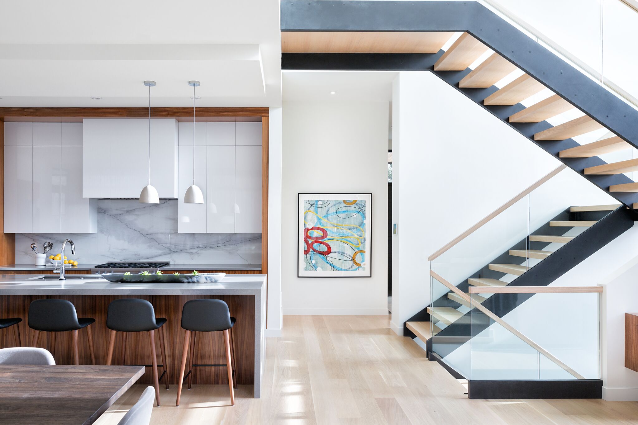 Kitchen and Staircase Views at Elbow Park Modern, Nyla Free Designs, Calgary Interior Designer, DeJong Design Associates, Insignia Custom Homes, Phil Crozier Photography