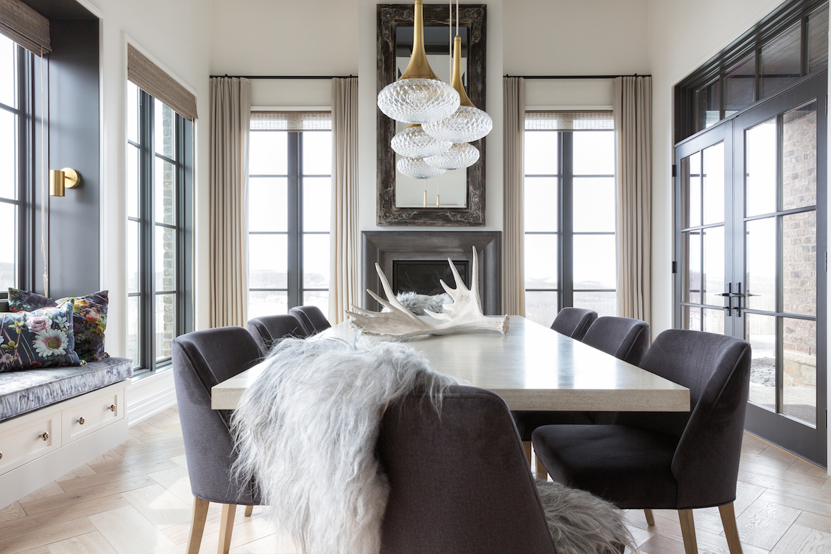 The Dining Room with fireplace, window seat and seating for ten from a Rural Alberta Country House, Interior Design by Calgary Design Studio Nyla Free Designs Inc, Architecture: Dejong Design Associates, Photography: Phil Crozier #calgaryinteriordesign #calgaryinteriordesigner #nylafreedesigns #diningroominspirations #countryhouse