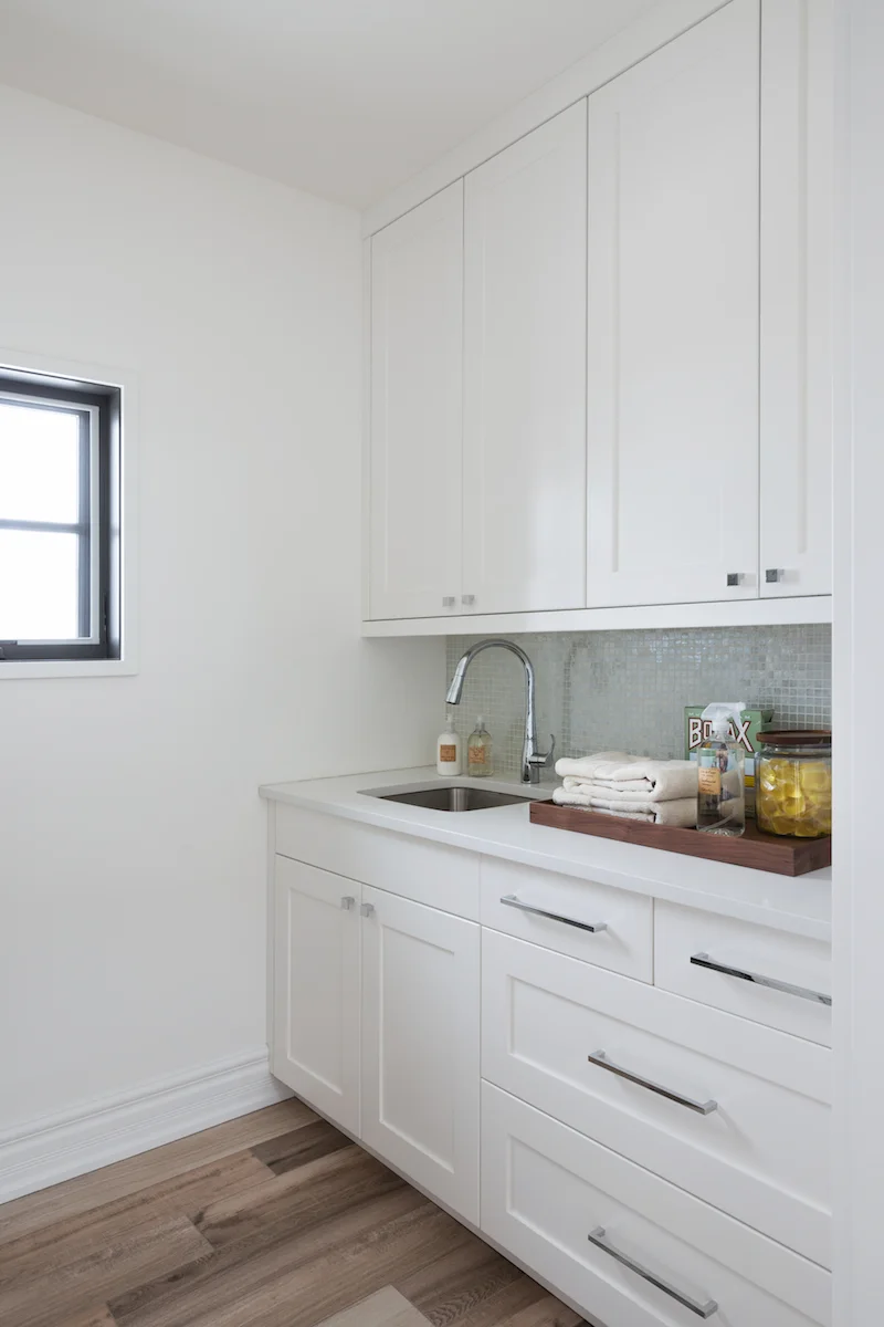 The laundry room from a Rural Alberta Country House, Interior Design by Calgary Design Studio Nyla Free Designs Inc, Photography: Phil Crozier #calgaryinteriordesign #calgaryinteriordesigner #nylafreedesigns #laundryroominspirations #countryhouse