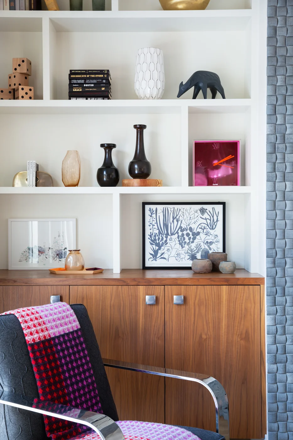The Living Room with side chair, fireplace, and styled shelving from an Elbow Park Residence, Interior Design by Calgary Design Studio: Nyla Free Designs, Photography: Phil Crozier #nylafreedesigns #nfdielbowparkluxe #livingroomdesign #designinspira