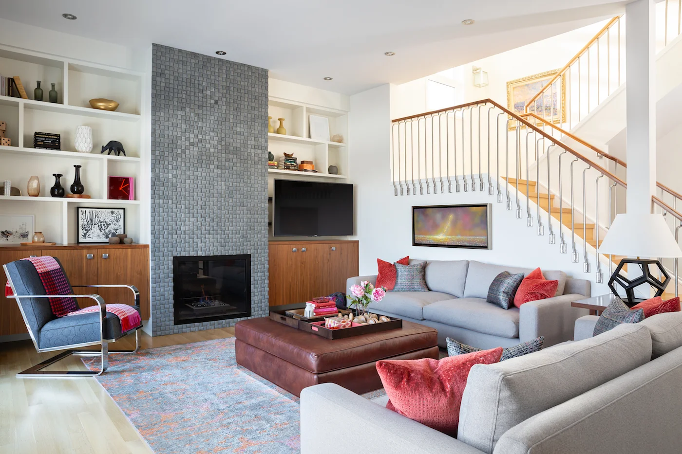 The Living Room with two sofa’s and side chair, fireplace, and styled shelving from an Elbow Park Residence, Interior Design by Calgary Design Studio: Nyla Free Designs, Photography: Phil Crozier #nylafreedesigns #nfdielbowparkluxe #livingroomdesign #designinspirations
