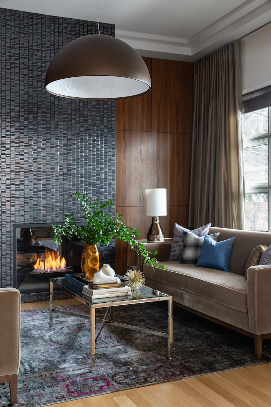 The sitting room with paired sofa’s framing fireplace, with walnut millwork from an Elbow Park Residence, Interior Design by Calgary Design Studio: Nyla Free Designs, Photography: Phil Crozier #nylafreedesigns #nfdielbowparkluxe #sittingroomdesign #