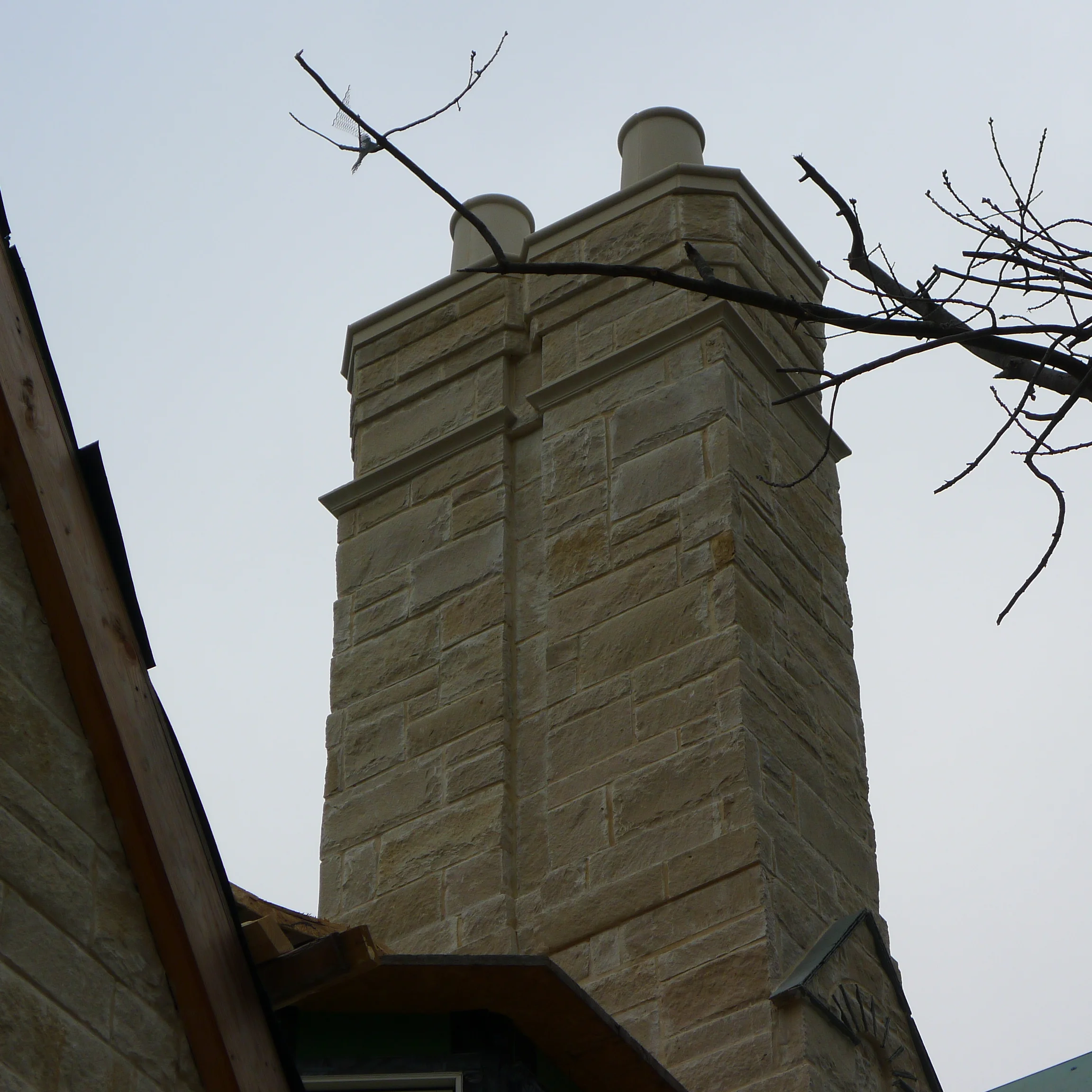 Double Chase Stone Chimney w/ Cast Stone Detail