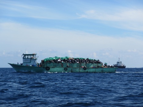 A barge bringing waste to be burned to Thilafushi, nicknamed “Trash Island.”